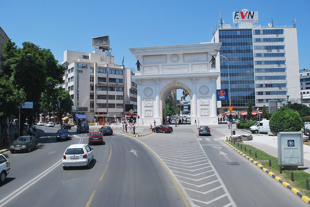 View framed through Porta Macedonia arch on Pella Square, Skopje